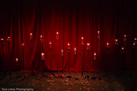 Offbeat Bride Rachel uploaded these stunning photos of her "red velvet wedding decor" to our Flickr pool. My first thought was "Oooooh, this would be fabulous decor for a Halloween wedding." From the candle-lined aisle, to the corners dripping in blood red roses, you're going to want to have a gawk-out over this decor inspiration… Halloween Venue Decorations, Red Line, Goth Backdrop Ideas, Rose Photo Backdrop, Black And Red Wedding Backdrop, Red Halloween, Candle Backdrop, Red Rose Installation, Wedding Reception Candles