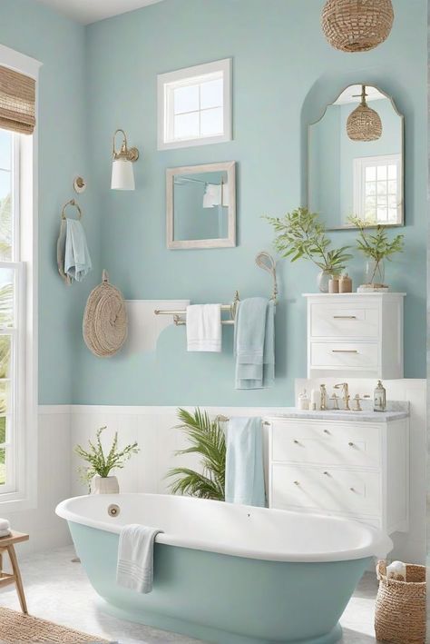 Ever wonder how you can bring the serene beauty of the ocean into your home? Imagine stepping into your bathroom and feeling as if you've been transported to a tranquil seaside retreat. With the right coastal bathroom ideas, you can achieve this serene transformation. From nautical accents to breezy color palettes, these 29 inspiring concepts Modern Beach Cottage Bathroom, White And Aqua Bathroom, Pale Blue Bathroom Walls, Blue Boho Bathroom, Kitschy Bathroom, Sw Watery, Bathroom Aqua, Calming Bathroom, Coastal Style Bathroom