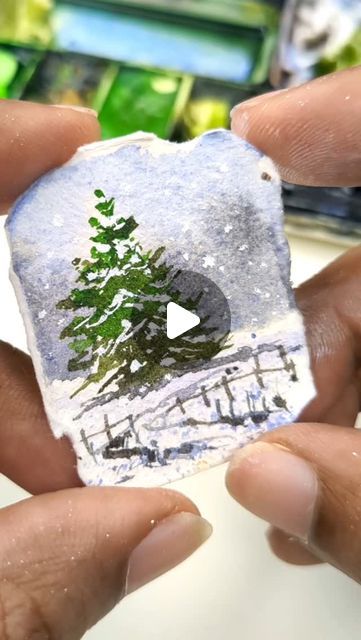 Irshad Ahmad Ansari on Instagram: "Creating a magical winter scene in miniature! ❄️  Watch as this tiny Christmas landscape comes to life with just a few brushstrokes. It's all about the details!  Save this reel and give it a try, and don’t forget to share your mini masterpieces with me. Happy painting!  Join my upcoming Watercolor Beginner Course and dive into the vibrant world of watercolor!  Sign up now for the exclusive waiting list and get an early bird discount when the course launches!  Link in bio!  Hurry up!  #MiniatureWatercolor #winterlandscape #christmaspainting #Watercolor #artreels" Winter Watercolor Simple, Miniature Watch, Christmas Scene Drawing, Tiny Watercolor Paintings, Watercolor Sign, Crafts 2024, Mini Masterpieces, Tiny Watercolor, Tiny Landscape