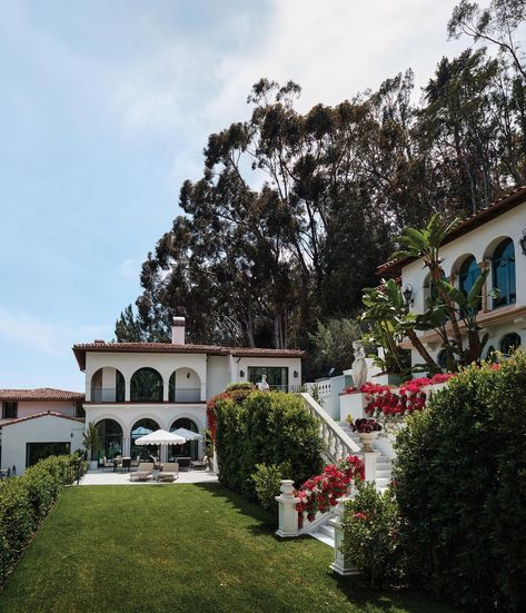 A view of the main house; the guesthouse is at right. Smith bought the property... Santa Monica House, Santa Monica Houses, Colonial Estate, Celebrity Kitchens, Spanish Revival Style, House California, Spider Lilies, Colonial Mansion, Secret Doors