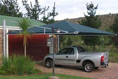 Why you should think about a car shed in your compound | Monitor Carport Shade, Sloped Backyard Landscaping, Car Shed, Carport Canopy, Car Shelter, Metal Doors Design, Sloped Backyard, Car Shade, Carport Designs