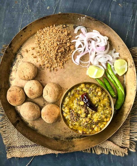 Rajasthani Dal Bati Churma Recipe is a very traditional recipe from Rajasthan and one if the favorites at home. The Baatis are made from whole wheat flour, sooji and ghee with the addition of ajwain that adds to the delicious flavor of the baati. I like to personally use freshly ground wheat for certain dishes like baati as it brings out the best flavors. The dal is usually a combination of multiple dals and I keep making variations to the dal to give the family a fresh taste. Serve the ... Churma Recipe, Dal Bati Churma, Rajasthani Recipes, Bhurji Recipe, Rajasthani Food, Dal Recipe, Indian Breakfast, Authentic Recipes, Special Recipes