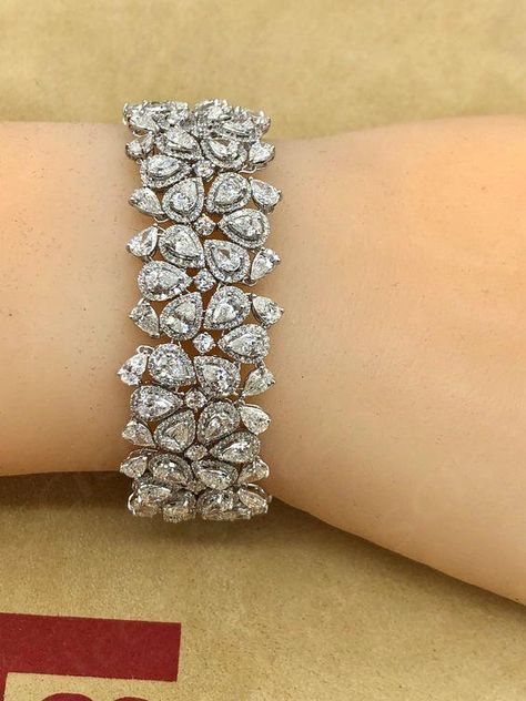 Hand made in the Emilio Atelier this bracelet is 21mm wide and 7 inches long. 265 pear shape and round diamonds totaling approx 22.20 carats of diamonds. Set in 18k white gold. Color: E-F Clarity: Vvs1-Vs2 overall Professional appraisal included  ... daha fazla Fancy Diamond Bracelet, Real Diamond Bracelet Designs, Diamond Hand Bracelet, Emilio Jewelry, Diamond Bracelet Design, Designer Diamond Jewellery, Retro Bracelet, Bridal Diamond Jewellery, Bracelets Design