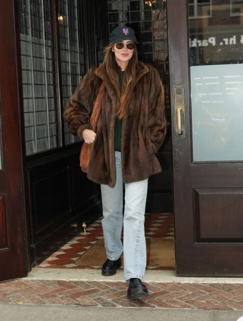 Celebrity Winter Outfits: Looks We Want to Copy in 2024 | Who What Wear UK Celebrity Winter Outfits, Fur Coat Outfit Casual, Coldplay Singer, Fur Coat Outfits, Coat Styling, Fur Coat Outfit, Dakota Johnson Style, Suede Trench Coat, Long Black Coat