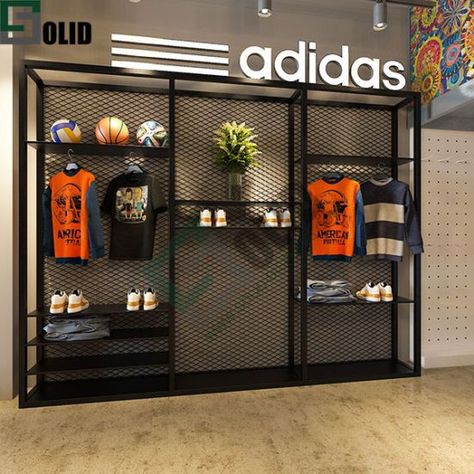 Cool Retail Spaces, Product Display Wall Design, Merchandise Display Design, Gym Display Ideas, Merch Wall Display, Merch Wall, Merch Stand Ideas, Cloth Store Interior, Industrial Shop Design