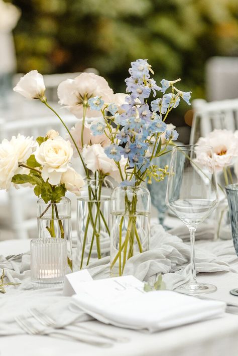 bud vase flowers blue, white, blush on grey table linens, fox hollow farm wedding venue near seattle, WA, wedding photographer Spring Wedding Blue Colors, Spring Flower Wedding Decor, Wedding Florals Bud Vases, Flowers In Mason Jars Wedding, Bud Vase Flowers Wedding, Wedding Decoration Idea, Blue Flower Wedding Decoration, Blue Garden Wedding Theme, Blue Pink White Wedding Theme