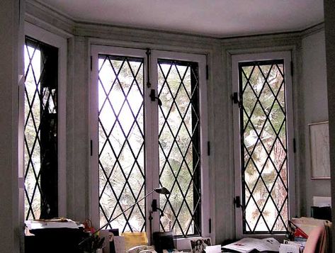 This leaded lattice bay window will give your home an authentic cottage feel. Window Security Bars, Home Window Grill Design, Burglar Bars, Leaded Glass Windows, Bookcase Styling, Tudor Style Homes, Window Grill Design, Window Grill, House Window