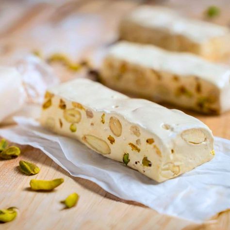 Learn how to make nougat that's smooth, chewy, and full of nuts! A step-by-step guide for perfect homemade nougat. Ready in just 30 minutes! Homemade Nougat Recipe, Diy Nougat Recipe, How To Make Nougat, How To Make Nougat At Home, Old Fashioned Holiday Nougat, Holiday Nougat, Cream Of Tartar Substitute, Best Nougat Recipe, Homemade Nougat