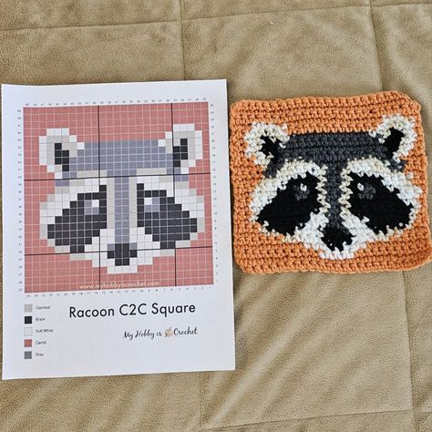 Crochet Raccoon Applique, Raccoon Granny Square, Crochet Grid Patterns Halloween, What To Crochet With Black Yarn, Gamer Crochet Ideas, Crochet Raccoon Free Pattern, Small Tapestry Crochet Pattern, Raccoon Pixel Art, Pixel Crochet Pattern Charts