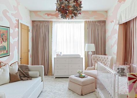 Lovely pink nursery boasts a butterfly pendant lighting a lucite crib with a white and pink canopy adn a pink tufted chair matched with an ottoman and a white floor lamp. Contemporary Nursery, Stripped Wallpaper, Crib Nursery, Princess Palace, Wallpaper Nursery, Bathroom Installation, Nursery Room Design, Hand Painted Wallpaper, Silk Wallpaper