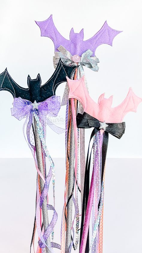 DIY Magical Felt Halloween Bat Wands in glitter pink & purple pastel colors by Laura Evangeline Pink Halloween Diy, Halloween Wands Diy, Pastel Halloween Diy, Pink And Purple Halloween Party, Pink Fairy Halloween, Handmade Pink Jewelry For Halloween, Diy Magic Wand, Diy Pink Witch Hat, Halloween Wands