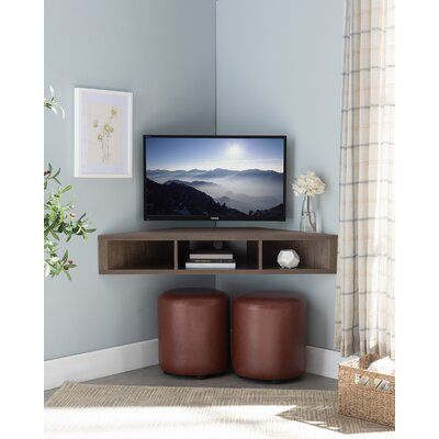 This wall-mounted 46'' TV stand brings space-conscious storage to your living room or apartment. Designed to fit in a corner unit with a floating mount, its clean-lined silhouette is crafted from engineered wood and showcases natural wood grain color variation. This media console features three open shelves for DVD and gaming storage, along with cable management to keep your space tidy. With a weight capacity of 150 lbs. this media console is a practical addition to your small living room or ent Corner Tv Unit Bedroom, Floating Corner Tv Stand, Corner Tv Console, Wall Mounted Media Console, Corner Tv Cabinets, Bedroom Tv Wall, Small Condo, Floating Tv Stand, Floating Tv