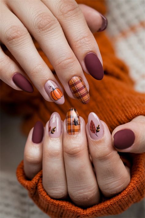 Embrace the cozy vibes of Fall with these adorable nail art designs that celebrate the beauty of autumn! Picture your nails adorned with warm tones of burnt orange, deep reds, and golden yellows, featuring charming leaf patterns or tiny pumpkins. These cute nail ideas are perfect for showcasing your seasonal spirit while adding a playful twist to your look. Get inspired and bring the essence of Fall to your fingertips! Nail Art With Pumpkins, Fall Nails Ideas Pumpkin, Round Autumn Nails, Fall Nails Pattern, Autumn Color Nails Fall, Thanksgiving Nail Designs Almond, Red Nails Fall Design, Short Nail Designs October, Nail Ideas For October