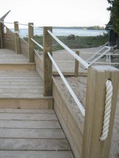 Rope Deck Porch Railings inspirational: 12 Breathtaking Rope Deck Railing Ideas Privacy Fence Entrance Ideas, Rope Fencing Ideas, Post And Rope Fence, Waterfront Fence Ideas, Beach Fence Ideas, Nautical Deck Ideas, Playhouse Deck, Lake Fence, Bridge Railing