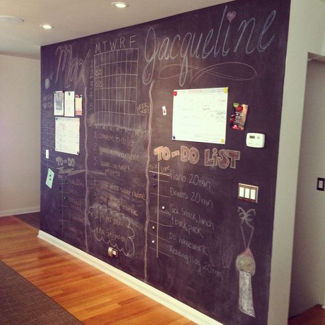 Kara Keller, MSK's founder and managing broker, used chalkboard and magnetic paint to create a feature wall in her dining room that doubles as a command center for the entire household. Chores, calendars, to-do lists, and even the pet lizard's growth chart have all found a home on the chalkboard wall. Office Chalkboard Wall, Chalkboard Command Center, Family Planner Wall, Chalkboard Organizer, Magnetic Paint, Home Panel, Family Planner, Chalkboard Wall, Command Center