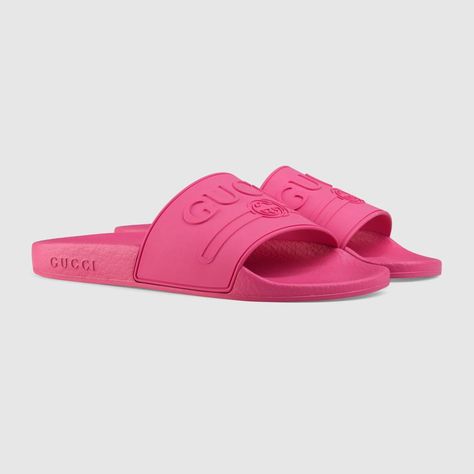 Shop the Gucci logo rubber slide sandal by Gucci. Imbued with the summer feel permeating the Pre-Fall 2018 collection, the Gucci vintage logo - originally inspired by retro prints from the 80s - is reworked in bright-hued rubber and presented on a series of colorful slide sandals. Pink Gucci Slides, Sport Sandals Outfit, Gucci Slides, Designer Slides, Gucci Pink, Gucci Store, Gucci Gifts, Slides For Women, Guccio Gucci