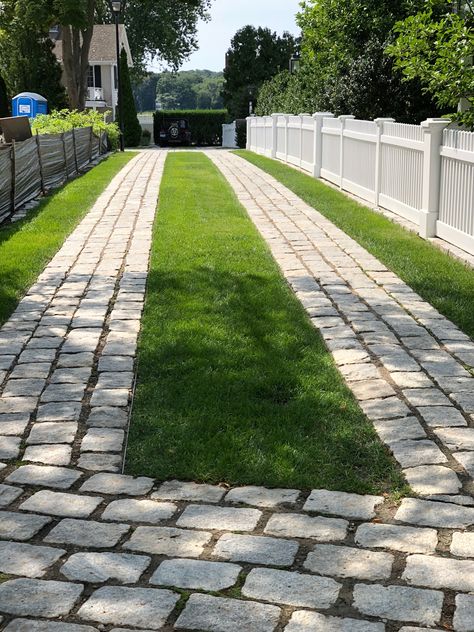 Beautiful and exceptionally done cobble stone and grass driveway in Essex, Connecticut. Stone And Grass Driveway, Brick Grass Driveway, Concrete Grass Driveway, Two Track Driveway, Concrete And Turf Driveway, Uphill Driveway Ideas, Driveway With Grass In Between, Grass Driveway Ideas, Stone Driveway Ideas