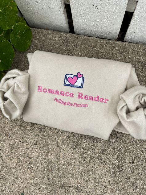 Romance book club Embroidered sweatshirt Book lover fashion Reader club apparel Romance-themed clothing Bookworm fashion Literary sweatshirt design Romance book enthusiast Reading community fashion Book club merchandise Novel-inspired fashion Reader lifestyle apparel Romance bookworm style Book Merch Ideas, Book Hoodies, Bookish Clothes, Book Sweatshirts, Booktok Merch, Bookish Style, Romance Reader, Book Merch, Bookish Merch