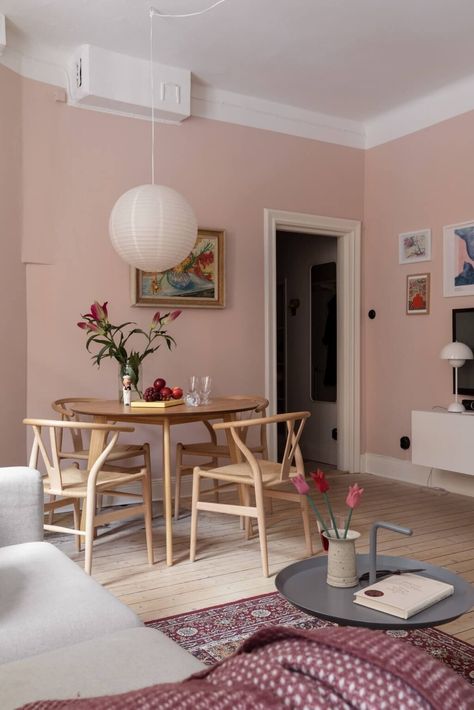 A Pink Living Room in a Scandinavian Apartment 9 Colourful Scandinavian Living Room, Mid Century Pink Living Room, Colourful Appartement, Pink And Wood Living Room, Pale Pink Living Room Walls, Colourful Scandinavian Interior, Pink Wall Living Room, Pink Walls Living Room, Pale Pink Living Room