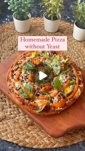 Dhruvi Jain on Instagram: "✨Satisfy your pizza cravings with our No-Yeast Homemade Pizza: a quick and easy crust alternative for a deliciously spontaneous pizza night at home. 🍕❤️  — Ingredients:  1/2 cup Maida  1 tbsp milk powder  Salt to taste  1/2 tsp baking powder 1/4 cup yoghurt  Milk to knead the dough   Rest the dough for 30 mins.  Roll the dough, apply Pizza sauce, add cheese and veggie of choice.   For Oven:  Pre- heat the oven @200 degrees for 10 mins & bake for 12-15mins.   For Kadai:  First, preheat the kadai on low flame for about 10 minutes. Place a small stand or trivet inside the kadai to elevate the pizza above direct heat. Once the kadai is hot, place the pizza base on it, add sauce, cheese, and toppings. Cover with a lid and cook on low flame until the crust is golden a Pizza Base Recipe Without Yeast, How To Make Pizza Dough Without Yeast, Homemade Pizza Without Yeast, Pizza Dough Recipe No Yeast, Pizza Without Yeast, Pizza Dough Without Yeast, Pizza Without Cheese, Pizza Night At Home, No Yeast Pizza Dough