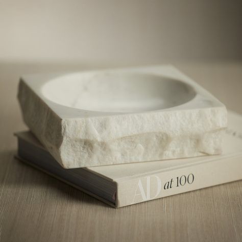 Details & Dimensions Perfectly polished, the Rock Finish White Marble Square Bowl is a timeless treasure. Crafted from the finest marble, its exquisite design and luxurious texture make it a sophisticated addition to any décor. This lustrous bowl is ideal for displaying trinkets and small accents. Dimensions: 10" x 3" Marble Accessories, Marble Square, Home Decor Boxes, Marble Bowl, Stone Accessories, Marble Tray, Coffee Candle, Home Decor Baskets, White Bowls