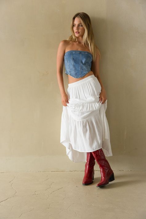 The Pippa Strapless Denim Corset Top is an edgy must-have! This strapless corset features a pointed hem, cropped fit, and denim finish! Pair this casual chic top with the Hope Tiered Maxi Skirt to complete the look!Details: 72% Cotton, 24% Polyester, 3% Rayon, 1% Spandex Back zipper Silicone grips Some stretch Hand wash cold/ Lay flat to dry Maxi Skirt And Crop Top Outfit, Outfits With Denim Top, Strapless Denim Top, Denim Top White Skirt, Flowy Denim Skirt Outfit, Denim Country Outfits, Jean Corset Top Outfit, Jean Top Outfit, Corset With Skirt Outfits