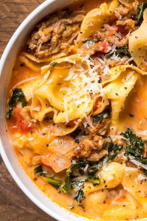 Looking for an easy healthy tortellini soup recipe? Try our flavorful crockpot sausage tortellini soup! Made with Italian sausage and tortellini, this soup is a comforting and satisfying meal. The slow cooker makes it incredibly convenient, allowing the flavors to meld together while you go about your day. Whip up a batch of this delicious sausage tortellini soup for a hearty dinner option that the whole family will love! Tortellini Soup Sausage, Tortellini Soup With Italian Sausage, Easy Winter Soups, Italian Sausage Tortellini Soup, Creamy Tortellini Soup, Sausage Tortellini Soup, Tomato Tortellini Soup, Sausage Tortellini, Italian Sausage Soup