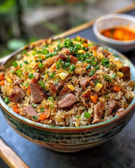 PORK FRIED RICE 🍚🐖 Ingredients: 2 cups cooked white rice (preferably day-old) 1 cup cooked pork, diced 1/2 cup frozen peas and carrots 1/2 cup diced onion 2 cloves garlic, minced 2 eggs, lightly beaten 3 tbsp soy sauce 2 tbsp vegetable oil 1 tbsp sesame oil 2 green onions, sliced Salt and pepper to taste Directions: Step 1: Prepare Ingredients Gather and prepare all your ingredients. Ensure the rice is cooked and cooled, the pork is diced, and the vegetables are ready... White Rice With Vegetables, Fried Rice Pork, Cool Foods, Frozen Peas And Carrots, Carrot Rice, Cooked White Rice, Rice Meals, Pork Fried Rice, Peas And Carrots