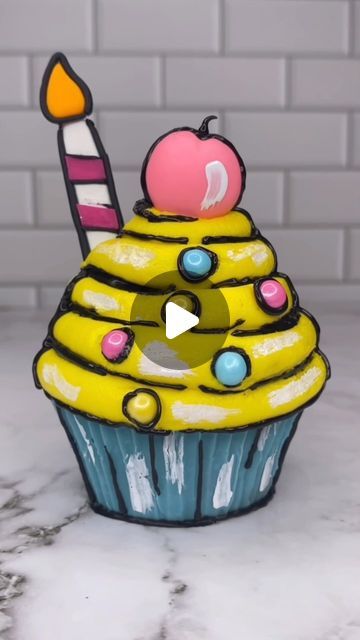 Rachel Lindsay on Instagram: "Cartoon cupcake 🩵💛💗🖤 It is all edible 🥳😊 I used @colour.mill oil colours for my chocolate and my cake batter. The cherry and the candle are made from fondant and the black lines are piped using black candy melts 🖤 This was way harder than I thought it would be 🫣 #cupcake #cupcakeart #cartooncake #cakedecorating #cakedbyrach #cakeart #isitcake" Raye Escapism, Cartoon Cupcakes, Black Candy, Cupcake Art, Cartoon Cake, Cake Trends, Cake Lover, Candy Melts, Cake Batter