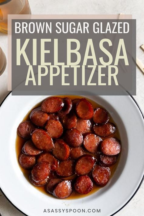 A white bowl with easy kielbasa bites in it with the words "brown sugar glazed kielbasa appetizer" in the foreground