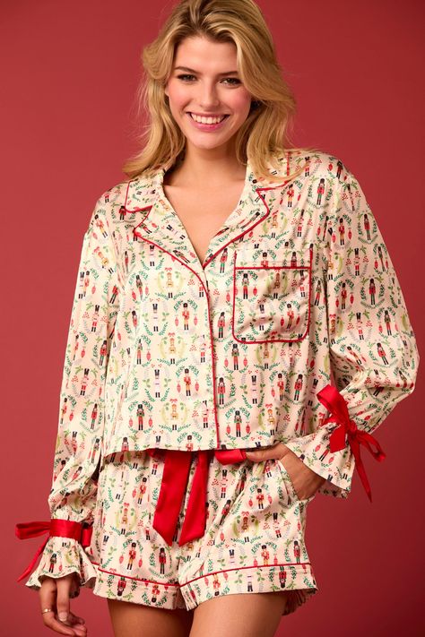 toy solider pattern bow sleeve detail satin pj set with red detailing Luxurious Pajamas, Christmas Toy Soldiers, Satin Pj Set, Shirt Collar Styles, Satin Pajama, Christmas Pajama Set, Cuffed Top, Cute Pajamas, Festive Design