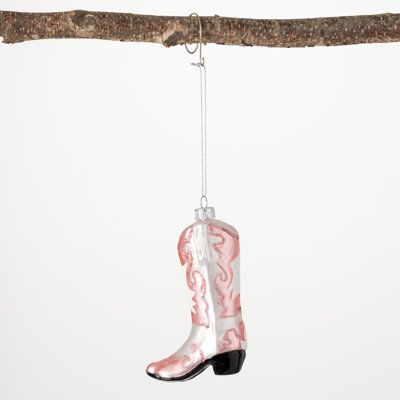 Add a little western whimsy to your Christmas celebrations with this feminine, pink cowboy boot novelty ornament. Designed with an intricate pink and white pattern, this cowboy boot ornament is sure to lighten the mood this Holiday season The Twillery Co.® | The Twillery Co.® Urbano Holiday Shaped Ornament 4.5 H x 1.25 W x 2.75 D in Glass | 4.5" H X 1.25" W X 2.75" D | Wayfair Cowboy Boot Ornaments, Pink Cowboy Boot, Boot Ornament, Pink And White Pattern, Book Ornament, Pink Cowboy Boots, Pink Cowgirl Boots, Pink Cowboy, Pink Book