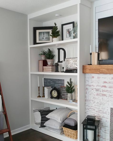 To complete the Faux Fireplace I added some built-in-bookshelves on both sides. I put the whole tutorial on the blog for you. Link in bio!… Built In Shelves Near Fireplace, Diy Built In Bookshelves Around Fireplace, Tall Bookcase Next To Fireplace, Diy Bookshelf Fireplace, Tv Built In Decor, Side By Side Bookshelves, Fireplace Bookshelves Built In Decor, Fireplace Bookshelves Diy, Built In Shelf Decor Living Room Entertainment Center