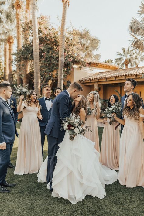 This bride stuns in a Hayley Paige wedding dress that she wore to her wedding at Historic 1929 Royal Palms Resort and Spa. The Historic Royal Palms Resort has a beautiful backdrop perfect for a wedding featuring pastel colored bridesmaid dresses, beautiful flowers by Bloom and Blueprint Event Co., a macaron bar and a spectacular sparkler exit. Wedding GOALS! #ruffledblog Wedding Suits And Bridesmaid Dresses, Beige Groom Navy Groomsmen, Champagne Wedding With Pops Of Color, Champagne Wedding Bridal Party, Light Pink Bridesmaid Dresses With Groomsmen, Champagne Wedding Theme Groomsmen, Gold And Navy Wedding Theme, Champagne And Light Blue Wedding, Navy And Light Pink Wedding