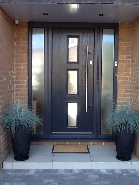 Contemporary grey front door grey with opaque sidelight window panels. Front Door With Panels, Black Doors Front Entrance, Dark Front Door Ideas, Windows By Front Door, Black Windows And Doors Exterior, Front Door With Side Windows Entrance, Front Door Grey, Frobt Door, Front Door Dark Grey