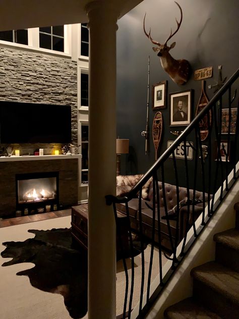 Dark Cabin Decor, Hunting Decor Living Room Modern, Black Western Living Room Ideas, Moody Hunting Lodge, Hunting Themed Basement, Dark Western Home Aesthetic, Western Black Living Room, Goth Western Aesthetic Home, Hunting Lodge Living Room