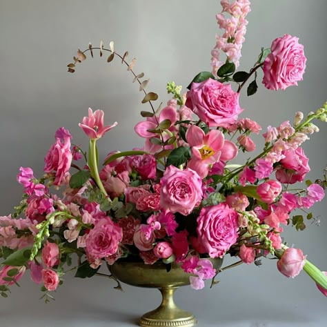 Stunning pink floral arrangement designed by Holly Heider Chapple. The flowers include the hot pink garden rose called Ashley which is grown by Alexandra Farms, along with snapdragons, tulips, spray roses, sweet peas and eucalyptus. Pink Flower Arrangements, Peony Arrangement, Rose Floral Arrangements, Rose Flower Arrangements, Hot Pink Weddings, Large Flower Arrangements, Flower Arrangement Designs, Medium Rare, Memorial Flowers