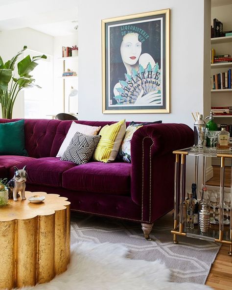 One living room, two views. Swipe to see the glam plum velvet sofa—then tap the link in our bio to tour the kitsch-meets-luxe apartment.… Interior Purple, Purple Couch, Purple Living Room, Purple Sofa, Minimalist Living Room Decor, Rooms Design, First Apartment Decorating, Fun Furniture, Colourful Living Room