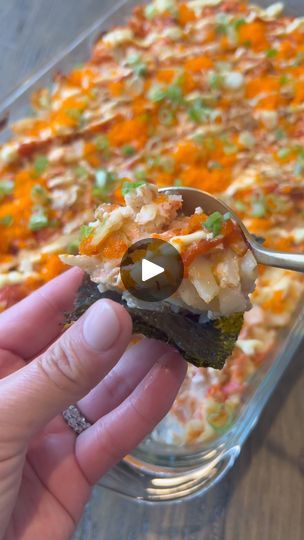 3.6K views · 79 reactions | Seafood sushi bake recipe - Ingredients: 2 salmon fillets, 1/2 tsp salt, 1/2 tsp pepper, 1 tsp garlic powder, 1/2 tsp paprika, 1.5 cups frozen bay scallops, 1.5 cups imitation crab meat, 8 oz softened cream cheese, 1/2 cup Japanese kewpie mayo, 2 tbsp sriracha. Sushi rice: 4 cups cooked rice, 3 tbsp rice wine vinegar / sushi vinegar, 1/8 tsp salt, 2 tbsp furikake seasoning.  Instructions: Wash and cook rice. Chop imitation crab meat and bay scallops into small pieces. Season salmon with salt, pepper, garlic powder and paprika. Cook salmon for about 7 minutes in the air fryer. Using a fork, shred the salmon then combine imitation crab, scallops, cream cheese, kewpie mayo and sriracha together. Mix thoroughly. In a baking dish, add the cooked rice, sushi rice vine Sushi Bake Recipe, Season Salmon, Cooked Sushi, Pieces Season, Unagi Sauce, Bay Scallops, Roasted Seaweed, Sushi Vinegar, Rice Sushi