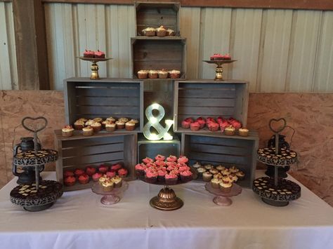 Cupcake display using wooden crates Crate Cupcake Stand, Cupcake Crate Display, Crate Dessert Display, 150 Cupcake Display, Cupcake Setup Display, Crate Cupcake Display, Cupcake Display Ideas, Pride Cupcakes, Fall Wedding Cupcakes