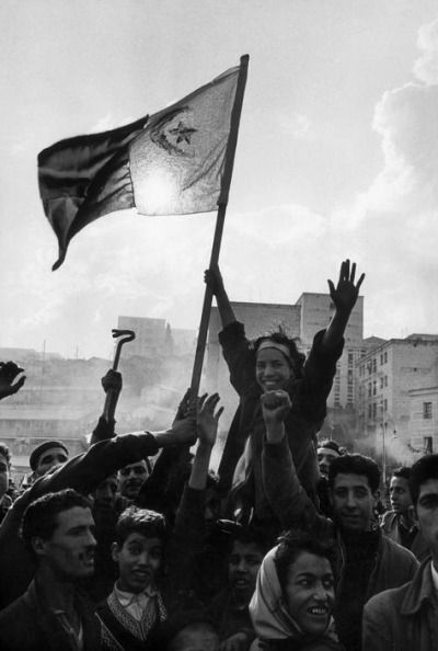 A group of young demonstrators raise the FLN flag. This was the first time that the green and white flag was waved publicly in the streets of Algeria, 1960 Algerian Flag, Algeria Flag, Middle Eastern Culture, African History, African Countries, Libya, North Africa, Morocco, Colorado