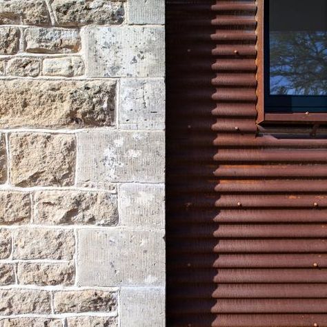 This design, prepared by CDA for the novelist Jeanette Winterson, involved the conversion of an existing redundant Grade II listed Gasworks in the Cotswolds to provide residential accommodation. Corten corrugated steel was chosen for the cladding of the single story courtyard extension making clear the distinction between old and new. Corrugated Metal Cladding, Corten Extension, Corten Cladding, Courtyard Extension, Corten Steel Cladding, Corrugated Metal Wall, Black Cladding, Corrugated Steel, Larch Cladding