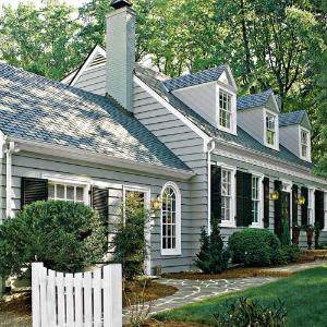 Cape Cod,A one story intricatly decorated house with gambled dormers Cape Cod Exterior, Cape Cod House Exterior, Cape Cod Style House, Black Shutters, Gray House, Cape House, Cape Cod House, Grey Houses, White Picket Fence