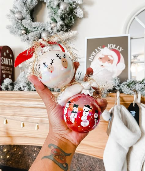 DIY shake paint & fingerprint ornaments 🎄❤️ These are such a fun way to create something that will last forever over the holidays and is so easy to do with the kiddos! We created a snowman family last year but I wanted to recreate that with 4 snowman this year since our family grew and also made this fun and easy reindeer design out of fingerprints ✨ We have been making a DIY ornament with Romeo every year since he was born but this year was extra special. Do you make DIY ornaments with your l Finger Paint Ornaments, Handprint Glass Ornaments, Thumbprint Snowman Ornament, Grandkid Ornaments Diy, Diy Ornament Toddler, Keepsake Diy Ornaments, Fingerprint Snowman Ornament, Christmas Fingerprint Ornaments, Christmas Photo Ornament Craft