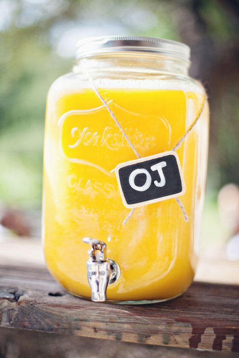 Orange juice served in mason jar drink dispenser Eid Brunch, Mason Jar Drink Dispenser, Juice Party, Wedding Brunch Reception, Orange Juice Drinks, Juice Jar, Breakfast Juice, Juice Dispenser, Hotel Breakfast