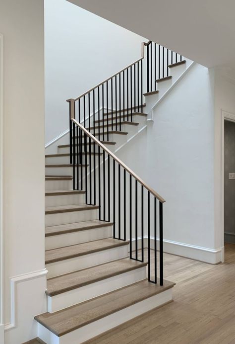 another simple example. iron railing with wooden top. Minimalist Handrail Stair Railing, Metal Railing With Wood Handrail, Black Steel Stair Railing, Stairs Wooden Railing, Simple Railing Design, Farmhouse Stairs Ideas, Rod Iron Stair Railing, Iron Railing Stairs, Minimal Staircase