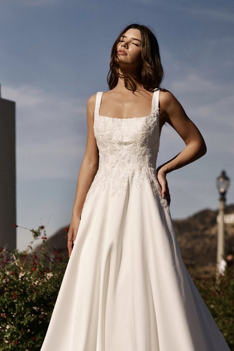 It has pockets!!! Luxe Mikado and embellished floral lace accents adorn the stunning A-line silhouette of Style 7897. Elegant shoulder straps join the modern square neckline of the impeccably tailored bodice as on-trend side cutouts offer a touch of glamour to this classic bridal look. #weddingdress #weddingdresses #weddingdressshop #weddingdressgoals #weddingdressideas #weddingdressinspo #bridalboutique #bridalboutiquewales #pronovias #stellayork Classic Bridal Look, Square Neckline Wedding Dress, Scoop Neck Wedding Dress, Pronovias Bridal, Square Neckline Dress, Wedding Party Bridesmaid, Prom Accessories, Stella York, Mothers Dresses