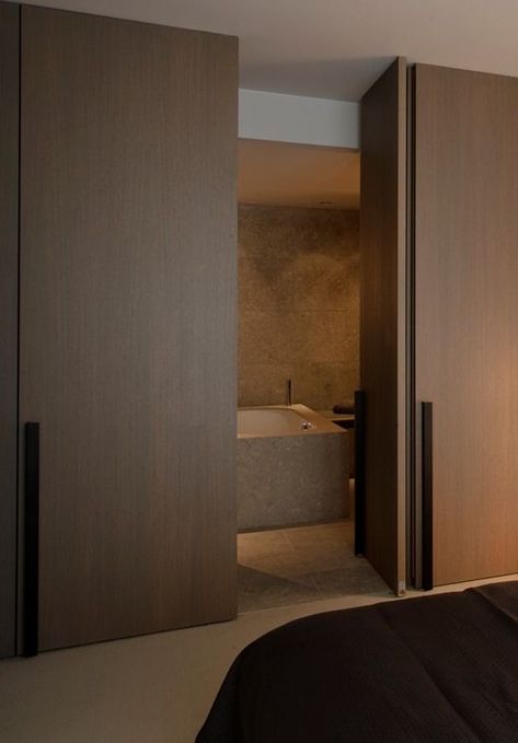 Wooden pivot door creating a nice and easy transition between bedroom and ensuite bathroom. (by Co. Studio): Frameless Door, Pivot Door, Pivot Doors, Ensuite Bathroom, Hidden Door, Design Apartment, Bathroom Doors, Wood Doors Interior, Internal Doors