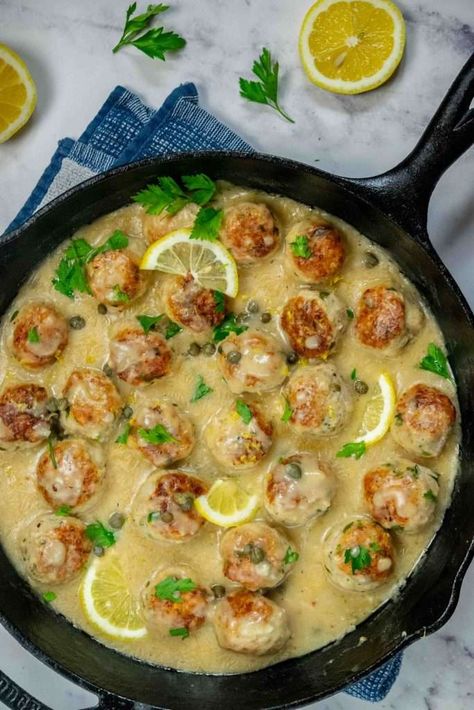 These easy Chicken Piccata Meatballs are stuffed with mozzarella, and cooked all in one pan in a creamy, decadent Piccata sauce! These tender and flavorful chicken meatballs with molten gooey cheese are impossible to resist! Mozzarella Chicken Meatballs, Meatballs Stuffed With Mozzarella, Chicken Piccata Meatballs, Easy Chicken Piccata, Piccata Sauce, Perfect Meatballs, Mozzarella Stuffed Meatballs, Best Meatballs, Cheese Stuffed Chicken