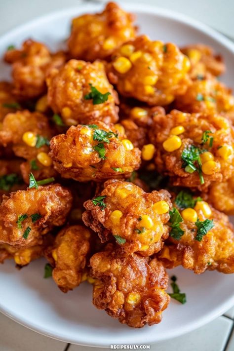 These delicious corn fritters are crispy on the outside and fluffy on the inside! Perfect as a snack or appetizer, they're packed with sweet corn and fresh herbs. You won't be able to resist these flavorful bites! Fried Corn Balls, Corn Fritters Air Fryer, Corn Fritters With Creamed Corn, Mexican Street Corn Fritters, Corn Appetizer Recipes, Baked Corn Fritters, Corn Fritters Recipe Easy, Air Fryer Corn Fritters, Savory Fritters